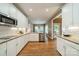 Bright kitchen showcases white cabinets, granite counters, and stainless appliances at 4033 Weddington Manor Ct, Matthews, NC 28104