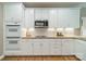 Kitchen features white cabinets, stainless appliances, and under-cabinet lighting at 4033 Weddington Manor Ct, Matthews, NC 28104
