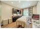 Multi-purpose room with dark cabinets, light fixtures, and wood flooring at 4033 Weddington Manor Ct, Matthews, NC 28104