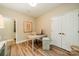 Neutral home office featuring wood floors, white trim and bright recessed lighting at 4033 Weddington Manor Ct, Matthews, NC 28104