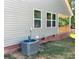 Exterior side of the home, showing the A/C and well-maintained lawn at 4049 Fincher Rd # 3, Matthews, NC 28104