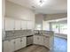 Modern kitchen featuring white cabinets, granite countertops, stainless steel appliances, and hardwood floors at 4049 Fincher Rd # 3, Matthews, NC 28104
