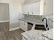 Well-designed kitchen with white cabinets, stainless steel appliances, and modern countertops at 4049 Fincher Rd # 3, Matthews, NC 28104