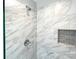 Close-up of the modern shower showcasing marble-like tile and a built-in soap and shampoo niche at 4049 Fincher Rd # 3, Matthews, NC 28104