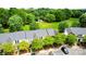 Townhomes with lush greenery, ample parking, and a view of the community at 4132 Kenton Glenn Nw Ct, Concord, NC 28027