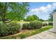 Scenic backyard with fence, landscaping, and lush greenery, creating a private outdoor space at 4132 Kenton Glenn Nw Ct, Concord, NC 28027