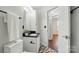Bathroom featuring black granite countertops and patterned flooring at 4132 Kenton Glenn Nw Ct, Concord, NC 28027