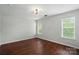 Bright bedroom with wood-look floors and windows offering lots of natural light at 4132 Kenton Glenn Nw Ct, Concord, NC 28027