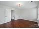 Spacious bedroom with wood-look floors, neutral paint, and plenty of natural light at 4132 Kenton Glenn Nw Ct, Concord, NC 28027