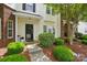 Inviting townhome entrance with well-kept landscaping and a welcoming pathway at 4132 Kenton Glenn Nw Ct, Concord, NC 28027