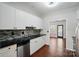 Modern kitchen with stainless steel appliances, mosaic tile backsplash, and black countertops at 4132 Kenton Glenn Nw Ct, Concord, NC 28027
