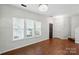 Bright and spacious living room with wood floors and ample natural light at 4132 Kenton Glenn Nw Ct, Concord, NC 28027