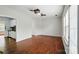 Bright living room with hardwood floors, ceiling fans, lots of natural light, and access to the kitchen at 4132 Kenton Glenn Nw Ct, Concord, NC 28027