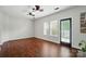 Bright living room featuring hardwood floors, ceiling fan, and natural light from windows at 4132 Kenton Glenn Nw Ct, Concord, NC 28027