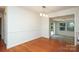 Spacious dining room featuring hardwood floors, trim detail, and an open layout at 4361 Applegate Rd, Charlotte, NC 28209