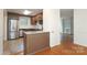 Updated kitchen featuring stainless steel appliances, granite countertops, and wooden cabinets at 4361 Applegate Rd, Charlotte, NC 28209