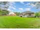 Large backyard with a fence, grassy area and shed, perfect for outdoor activities at 4405 Sugar Cane Ct, Waxhaw, NC 28173