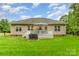 Spacious backyard with a wooden deck perfect for entertaining, and well-kept lawn at 4405 Sugar Cane Ct, Waxhaw, NC 28173
