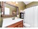 Clean bathroom with a vanity, mirror, and shower curtain, providing a functional space at 4405 Sugar Cane Ct, Waxhaw, NC 28173