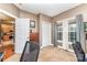 Neutral-toned bedroom boasts ample natural light from the window, complemented by a dresser and carpet flooring at 4405 Sugar Cane Ct, Waxhaw, NC 28173