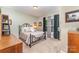 Relaxing bedroom with a comfortable bed, soft lighting, and large window, creating a serene retreat at 4405 Sugar Cane Ct, Waxhaw, NC 28173