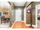 Hallway showing the flow into the eat-in kitchen with hardwood floors and neutral paint at 4405 Sugar Cane Ct, Waxhaw, NC 28173