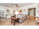 Inviting living room with comfortable seating, stylish decor, and a seamless transition to the dining area at 4405 Sugar Cane Ct, Waxhaw, NC 28173