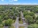 Aerial view features a cityscape in the background with a well-established residential community at 4553 Morgan St, Charlotte, NC 28208