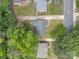 Birds eye view of residential homes with tree coverage and a neighborhood road at 4553 Morgan St, Charlotte, NC 28208