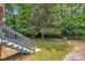 A large, enclosed backyard with mature trees and plenty of space to enjoy at 4553 Morgan St, Charlotte, NC 28208