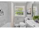 Stylish bathroom with marble tile, modern fixtures, and a bright, airy feel at 4553 Morgan St, Charlotte, NC 28208
