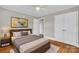 This bedroom boasts hardwood floors, a ceiling fan, and a closet that is perfect for storage at 4553 Morgan St, Charlotte, NC 28208