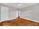 This bedroom boasts hardwood floors, a ceiling fan, and a closet that is perfect for storage at 4553 Morgan St, Charlotte, NC 28208