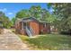 A brick home with a paved driveway and large fenced backyard at 4553 Morgan St, Charlotte, NC 28208