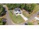 Aerial view of modern home showcasing its architectural design, well-manicured lawn, and surrounding mature trees at 4608 Rockwood Dr, Waxhaw, NC 28173