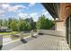 Spacious outdoor balcony with views of a tree-lined neighborhood and blue skies at 4608 Rockwood Dr, Waxhaw, NC 28173