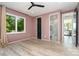 Bedroom with hardwood floors, a large window with green views, and en suite bathroom at 4608 Rockwood Dr, Waxhaw, NC 28173
