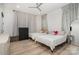 Bright bedroom with hardwood floors, ceiling fan, and two twin beds at 4608 Rockwood Dr, Waxhaw, NC 28173