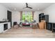 Spacious bonus room with wood floors, natural light, and ceiling fan, perfect for flexible living at 4608 Rockwood Dr, Waxhaw, NC 28173