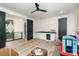 Spacious bonus room with stylish light fixture, a small wet bar, and neutral flooring at 4608 Rockwood Dr, Waxhaw, NC 28173