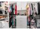 Walk-in closet with custom shelving, drawers, and rods for ample storage and organization at 4608 Rockwood Dr, Waxhaw, NC 28173