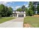 Contemporary home boasts clean lines, modern design, and well-manicured landscaping, offering curb appeal at 4608 Rockwood Dr, Waxhaw, NC 28173