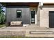 Inviting front porch with comfortable seating, stylish door, and a well-maintained walkway at 4608 Rockwood Dr, Waxhaw, NC 28173