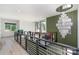 Upper hallway with a modern railing and an ornate chandelier, highlighting stylish interior design at 4608 Rockwood Dr, Waxhaw, NC 28173