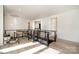 Upstairs hallway with hardwood floors, black banister, a view into other rooms, and hanging lighting at 4608 Rockwood Dr, Waxhaw, NC 28173
