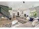 Open-concept floorplan featuring stairs, a living room area, and a kitchen with stainless steel appliances at 4608 Rockwood Dr, Waxhaw, NC 28173