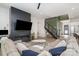 Spacious living room with dark-toned fireplace, comfortable sectional sofa, and modern decor at 4608 Rockwood Dr, Waxhaw, NC 28173