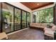 Inviting screened-in porch with comfortable seating, offering a serene outdoor retreat at 4608 Rockwood Dr, Waxhaw, NC 28173