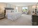 Tranquil main bedroom with plenty of natural light, stylish decor, and comfortable furnishings at 511 Lenswood Ct, Denver, NC 28037