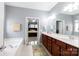 Bathroom features dual sink vanity, soaking tub, walk-in shower, and bedroom access at 52538 Winchester St, Fort Mill, SC 29707